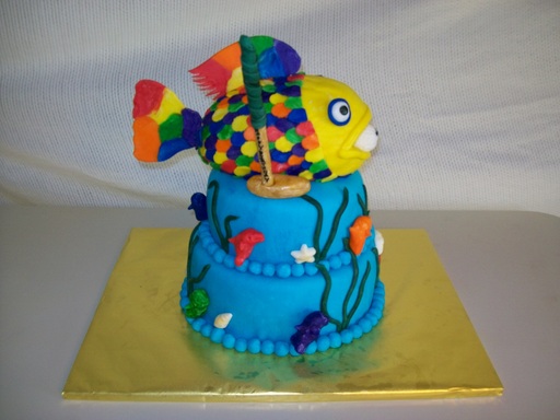 Rainbow fish with golfball and golf club cake
